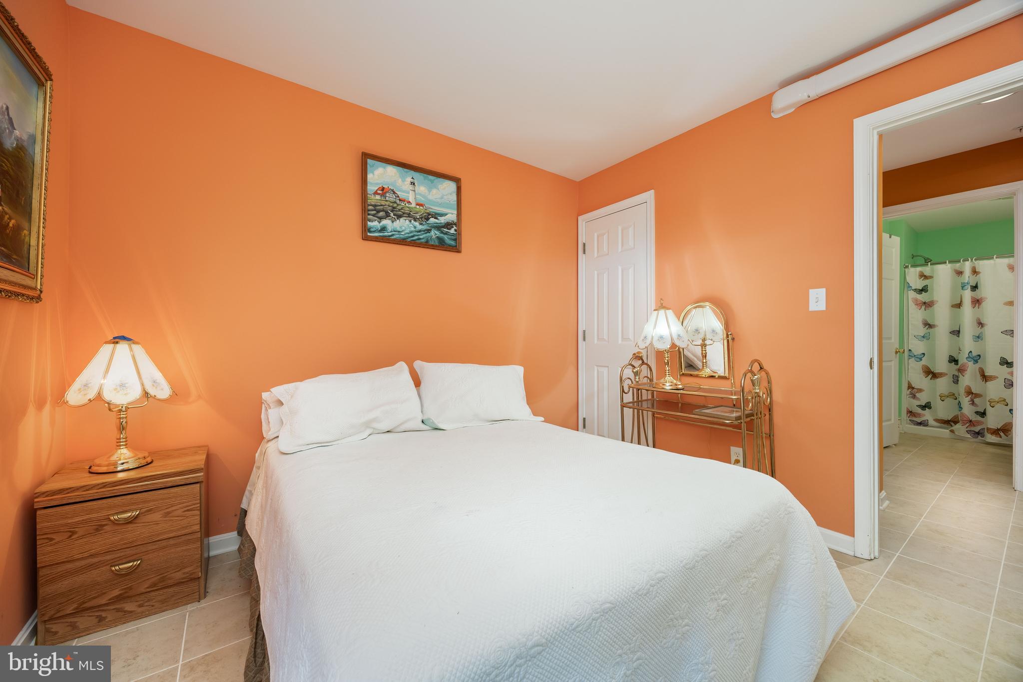 11427 Manklin Creek Road, Unit 7 Ocean Pines, MD 21811 - Photo 26 of 42 a bedroom with a bed and dresser