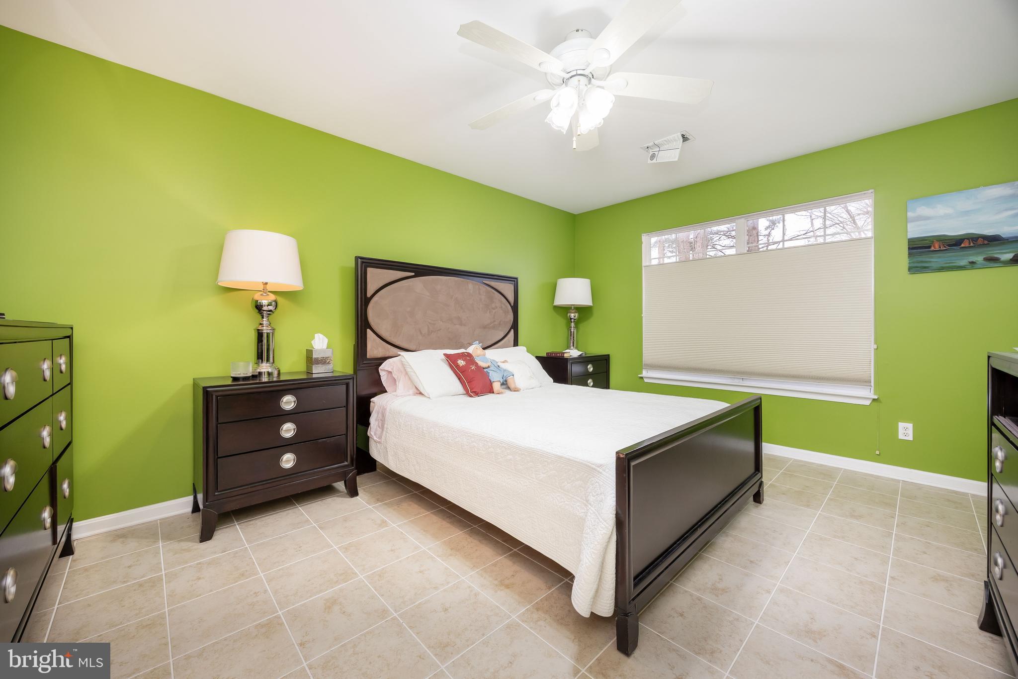11427 Manklin Creek Road, Unit 7 Ocean Pines, MD 21811 - Photo 28 of 42 a bedroom with a bed and a dresser