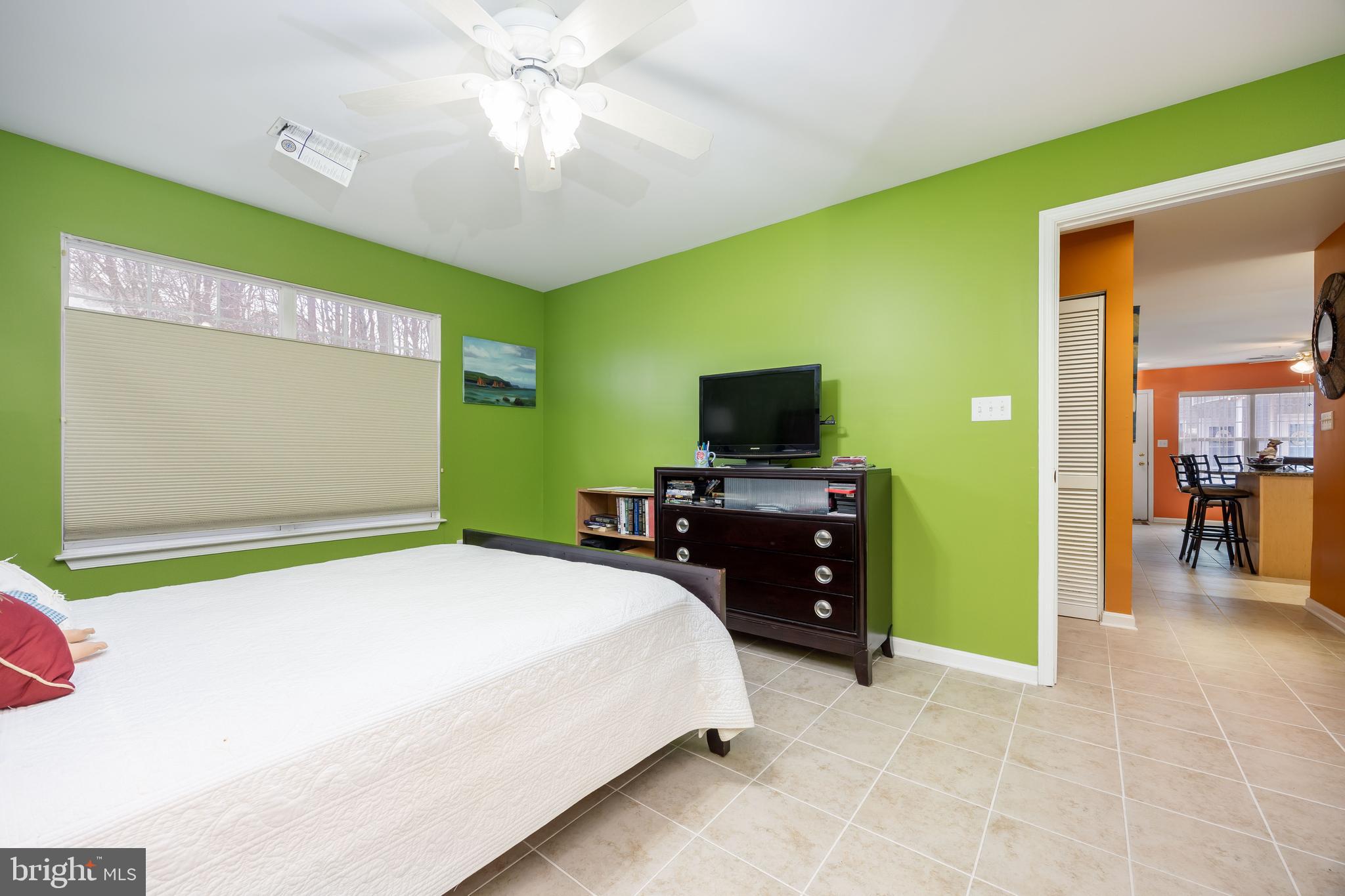 11427 Manklin Creek Road, Unit 7 Ocean Pines, MD 21811 - Photo 29 of 42 a bedroom with a bed and flat screen tv
