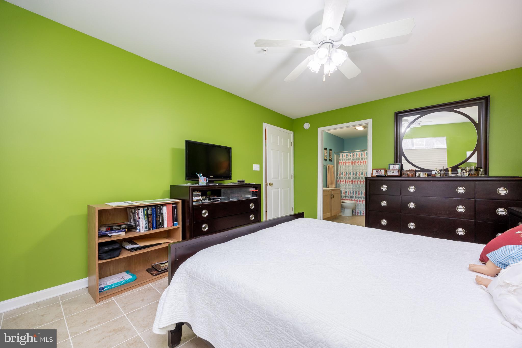 11427 Manklin Creek Road, Unit 7 Ocean Pines, MD 21811 - Photo 31 of 42 a bedroom with a bed and a flat screen tv