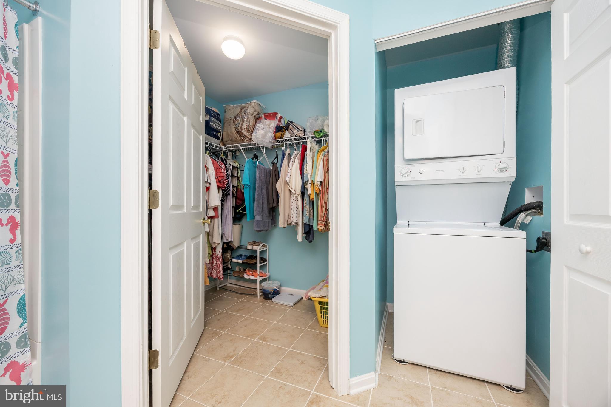 11427 Manklin Creek Road, Unit 7 Ocean Pines, MD 21811 - Photo 35 of 42 a view of walk in closet with clothes and shoes