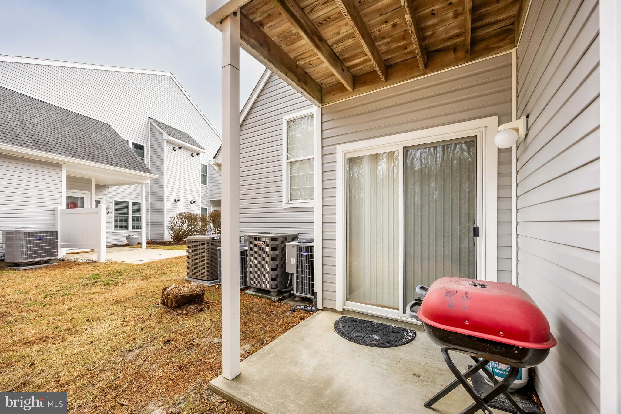 11427 Manklin Creek Road, Unit 7 Ocean Pines, MD 21811 - Photo 38 of 42 a view of a house with backyard and sitting area