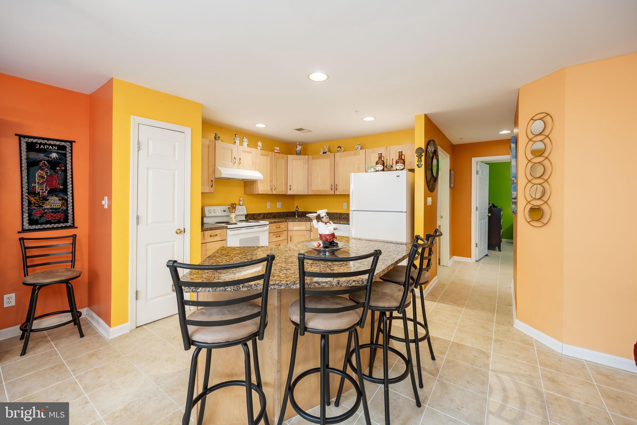 11427 Manklin Creek Road, Unit 7 Ocean Pines, MD 21811 - Photo 5 of 42 a dining room with furniture and a floor to ceiling window