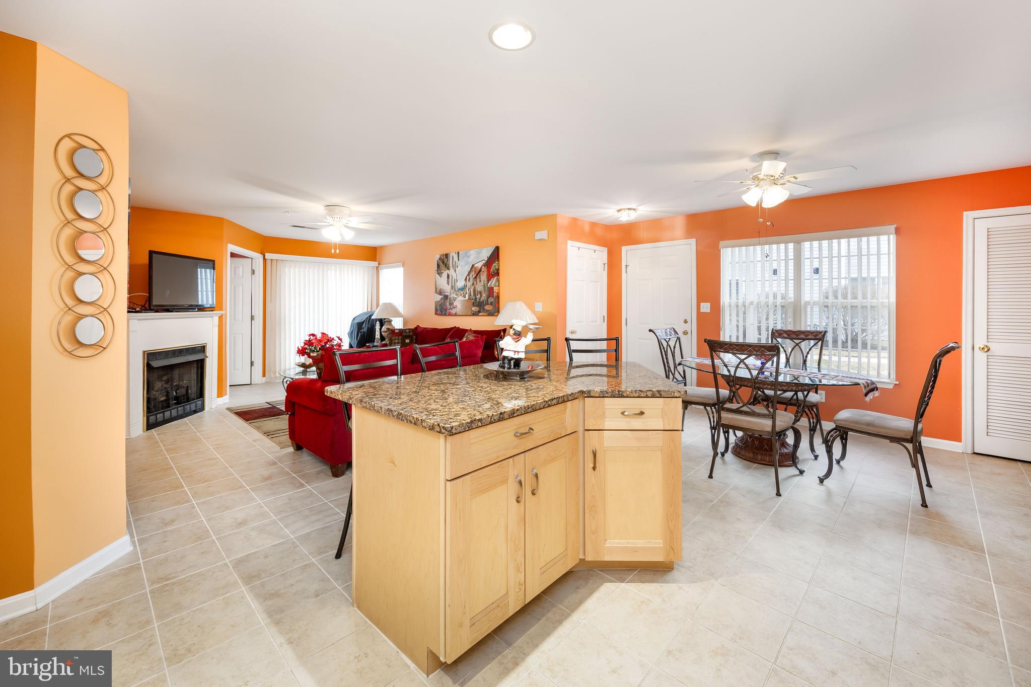 11427 Manklin Creek Road, Unit 7 Ocean Pines, MD 21811 - Photo 7 of 42 a kitchen with stainless steel appliances granite countertop a stove and cabinets