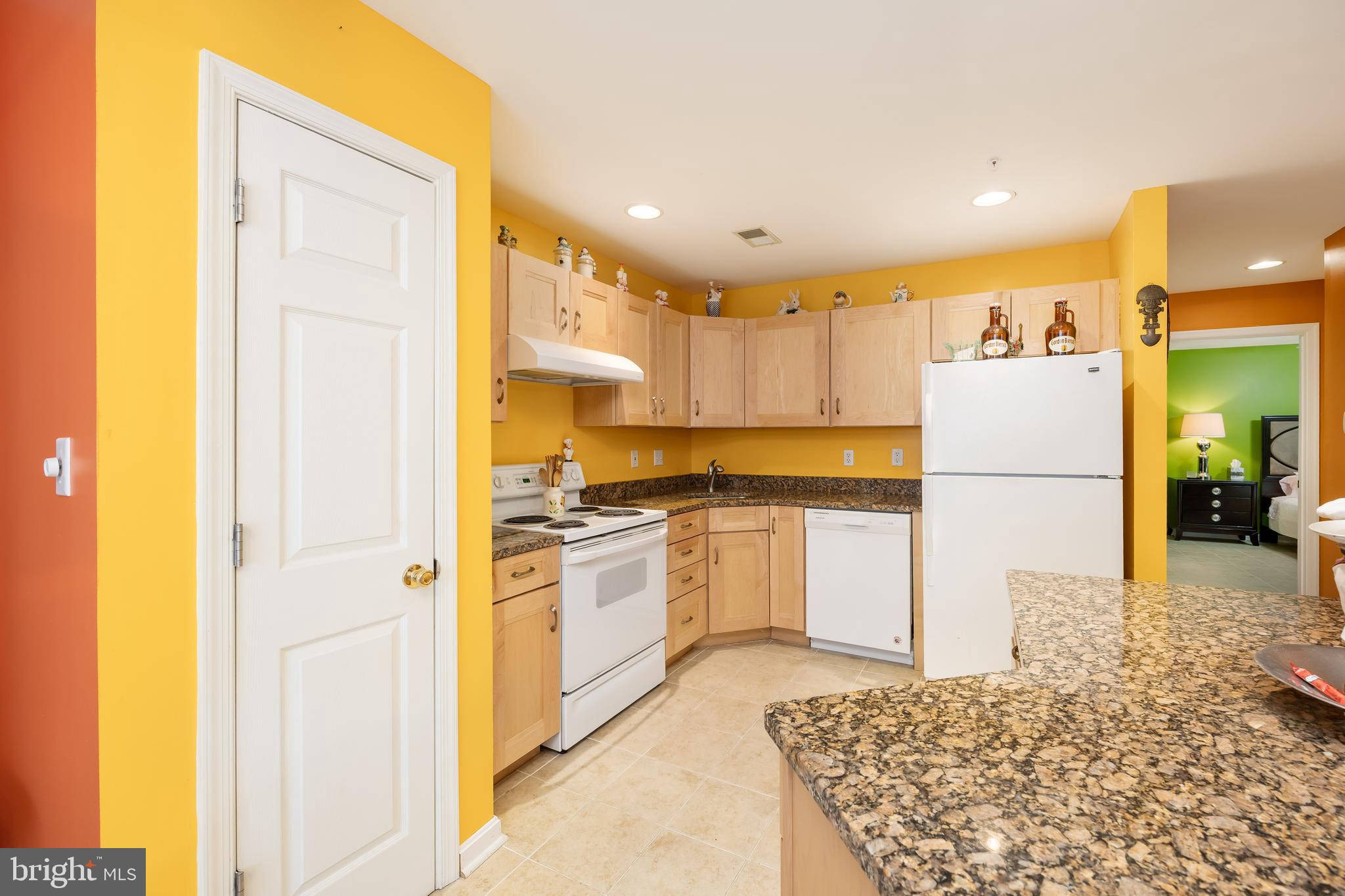 11427 Manklin Creek Road, Unit 7 Ocean Pines, MD 21811 - Photo 9 of 42 a kitchen with a refrigerator and a stove