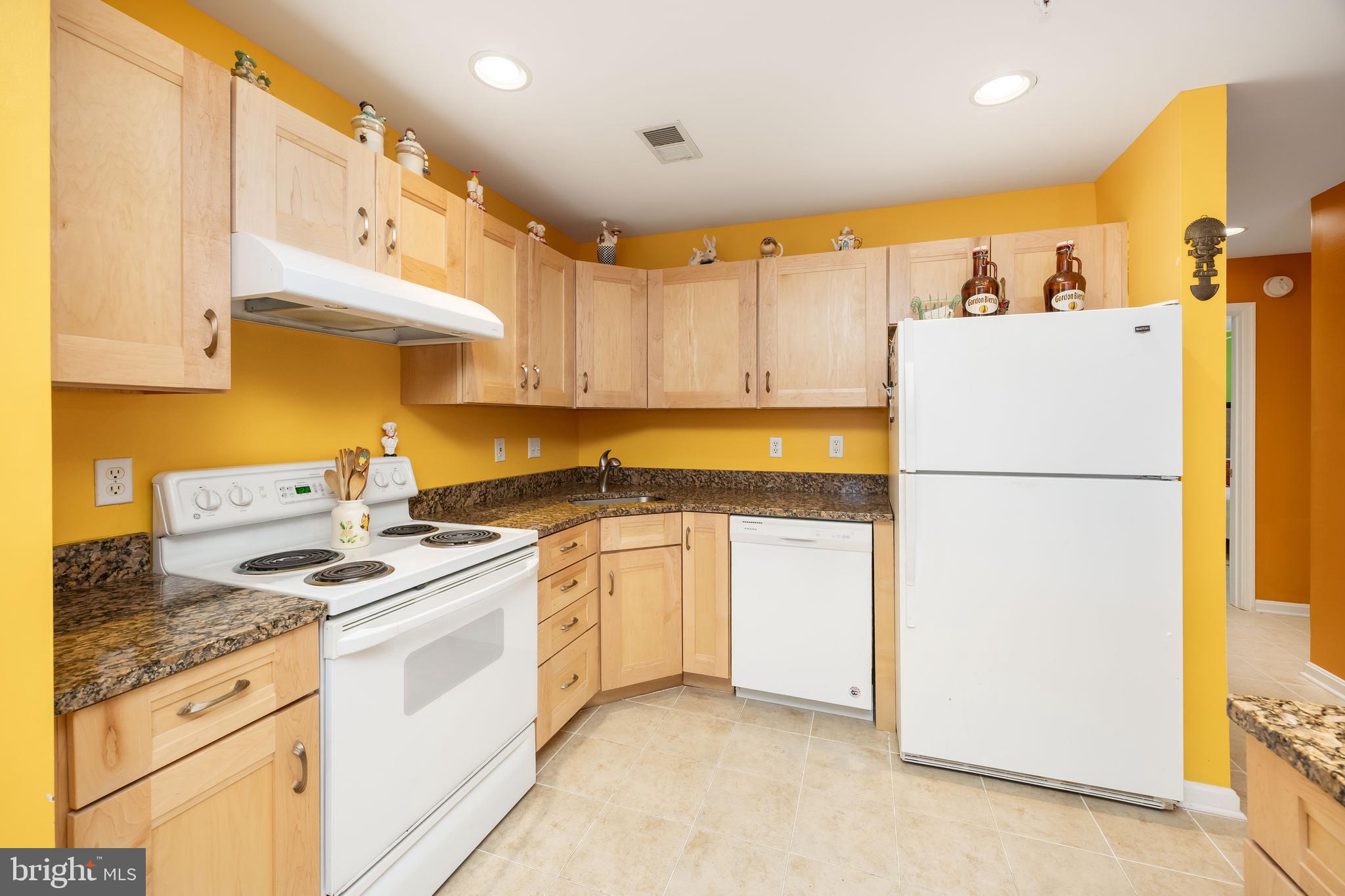 11427 Manklin Creek Road, Unit 7 Ocean Pines, MD 21811 - Photo 10 of 42 a kitchen with stainless steel appliances granite countertop a refrigerator a stove and a sink