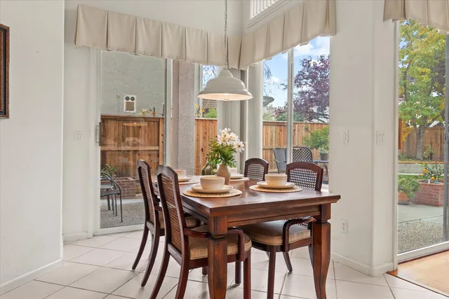 a dining room with furniture and window