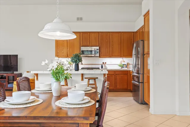 a living room with furniture a large window and a fireplace