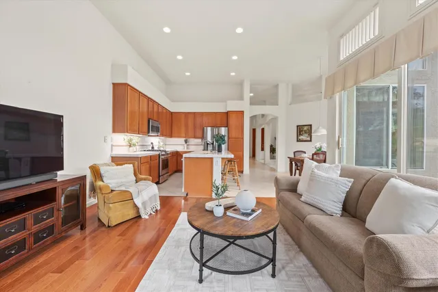 a view of a hallway with wooden flooring
