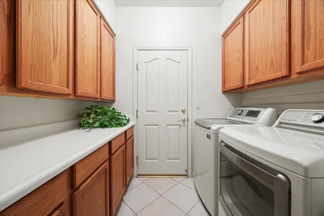 a bathroom with a double vanity sink toilet and shower