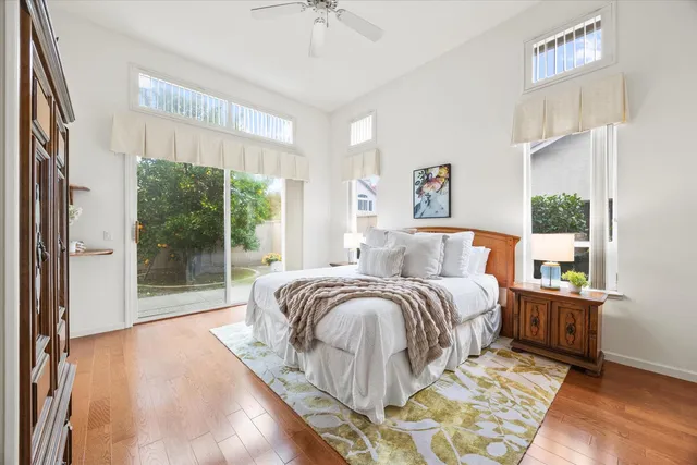 a bedroom with a bed dresser and a window