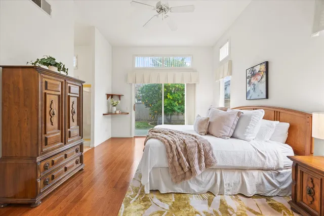 a spacious bedroom with a bed and a window