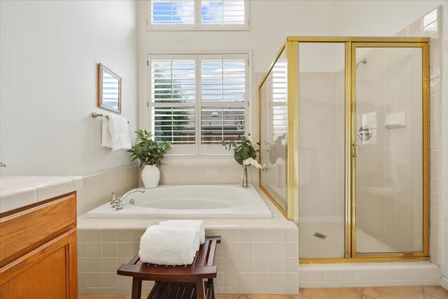 a white bath tub sitting next to a white sink