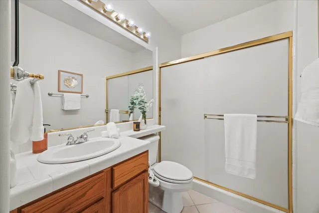 a view of a patio with couches table and chairs and potted plants