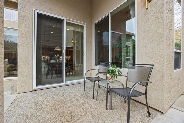 a view of a backyard with sitting area