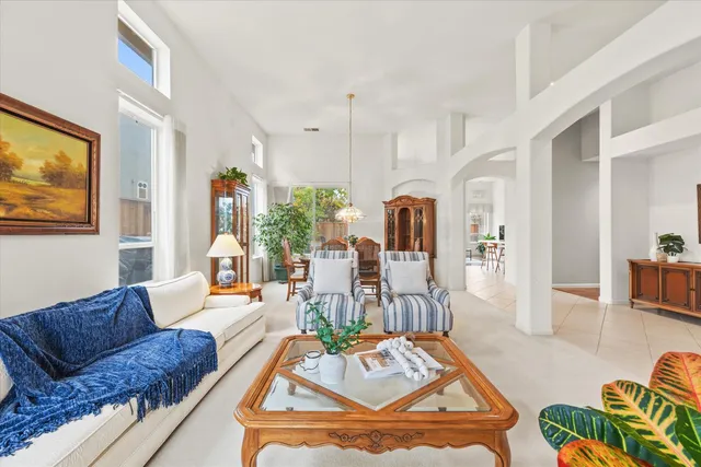a living room with furniture fireplace and a flat screen tv
