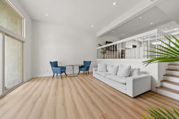 a living room with furniture and a table