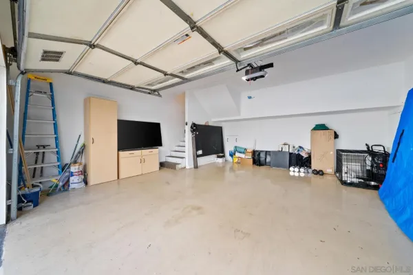 a view of a livingroom with furniture and a flat screen tv