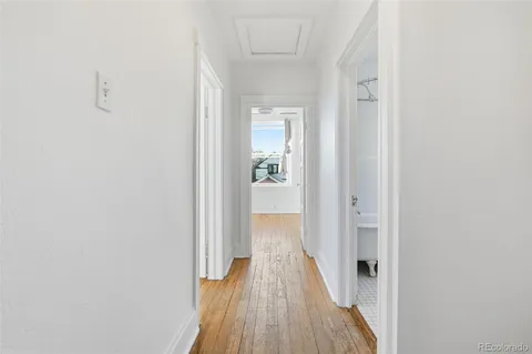 a view of a room with wooden floor
