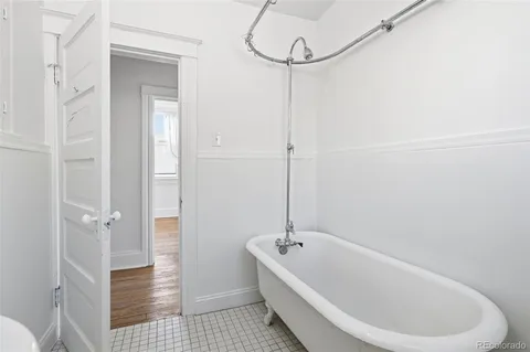 a bathroom with a bathtub and shower