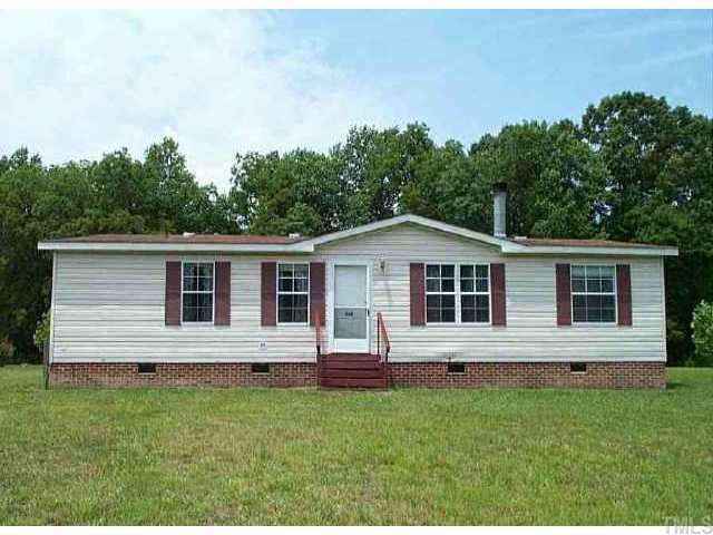 554 Locks Lane Rougemont, NC 27572 - Photo 1 of 1 a front view of a house with a yard