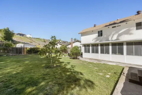 a view of a large pool with a big yard