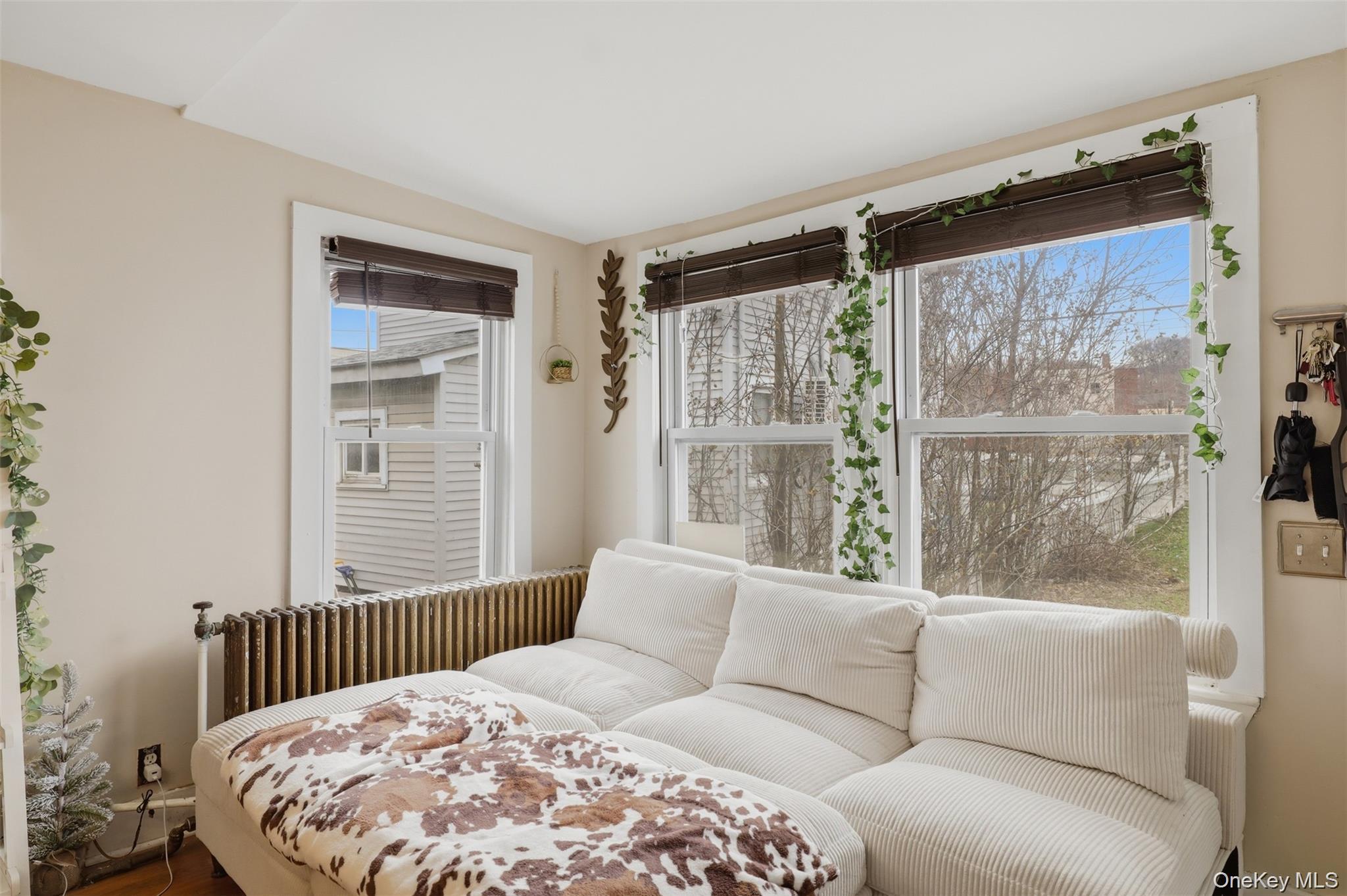 121 Little Britain Road Newburgh, NY 12550 - Photo 5 of 15 a bedroom with a large bed and a window