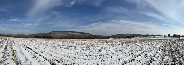 a view of ocean and mountains