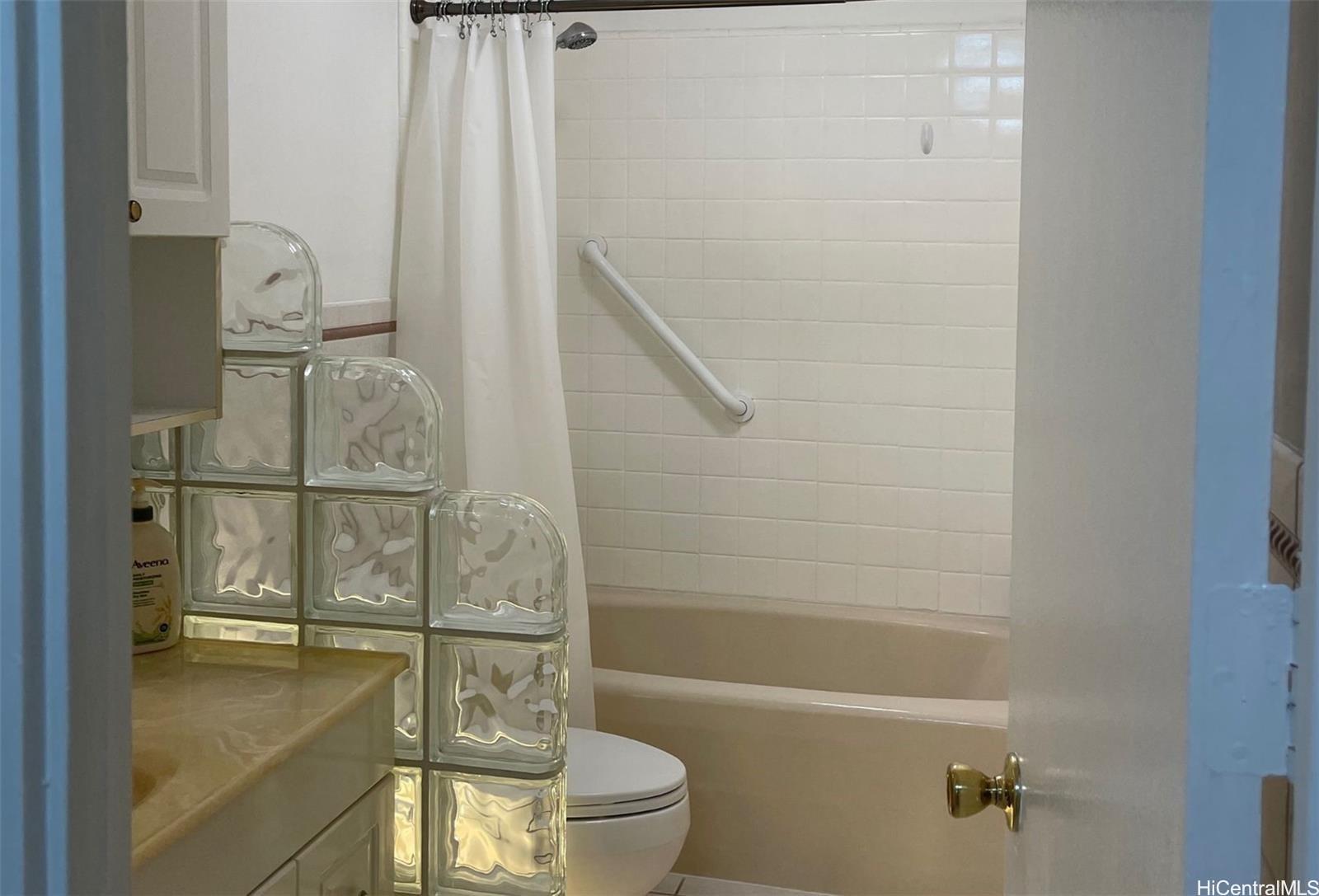 2415 Ala Wai Boulevard, Unit 1208 Honolulu, HI 96815 - Photo 13 of 13 a bathroom with a bathtub and shower