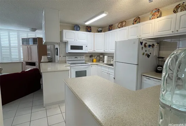 a kitchen with stainless steel appliances a refrigerator sink and cabinets