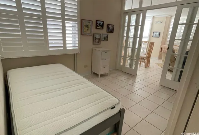 a bed room with a bed and a window