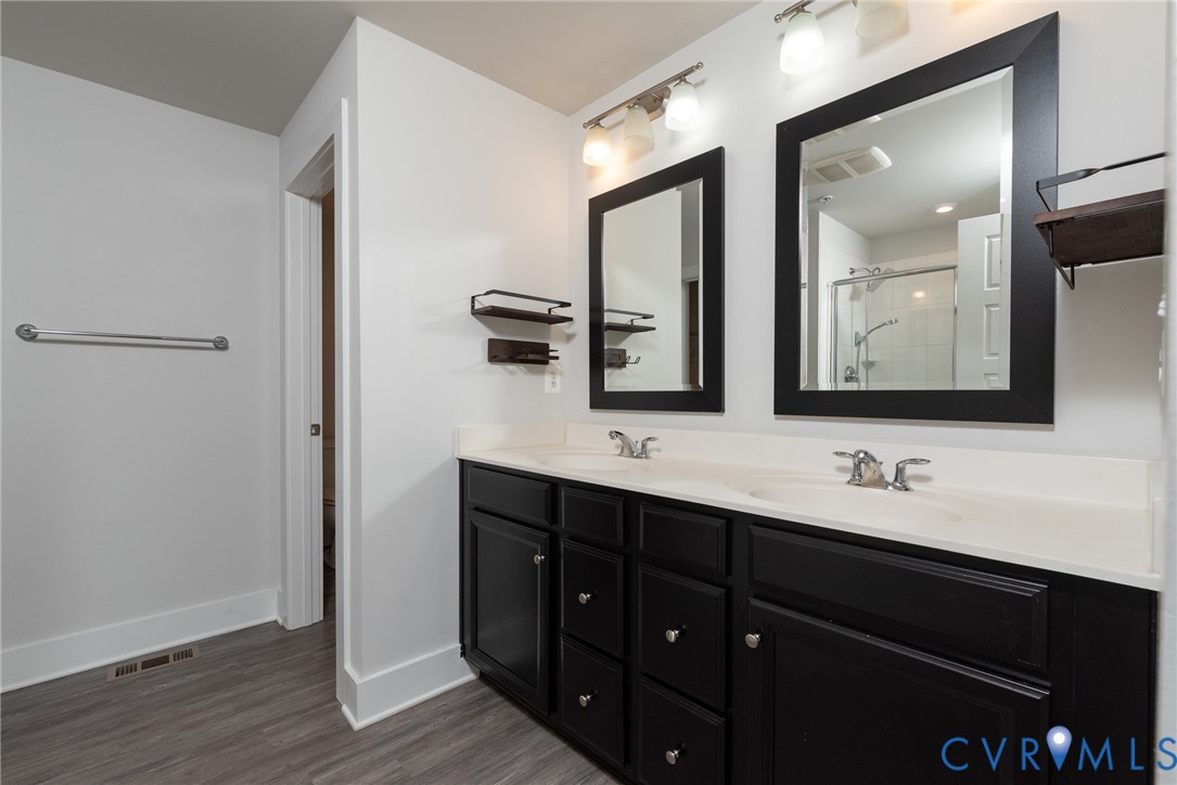 4352 Bon Secours Parkway, Unit A Henrico, VA 23233 - Photo 7 of 16 a bathroom with double vanity and a mirror
