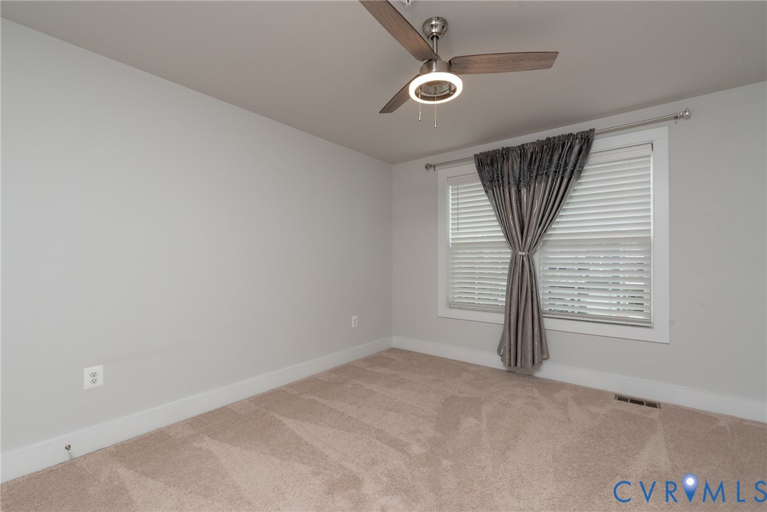 4352 Bon Secours Parkway, Unit A Henrico, VA 23233 - Photo 9 of 16 an empty room with windows