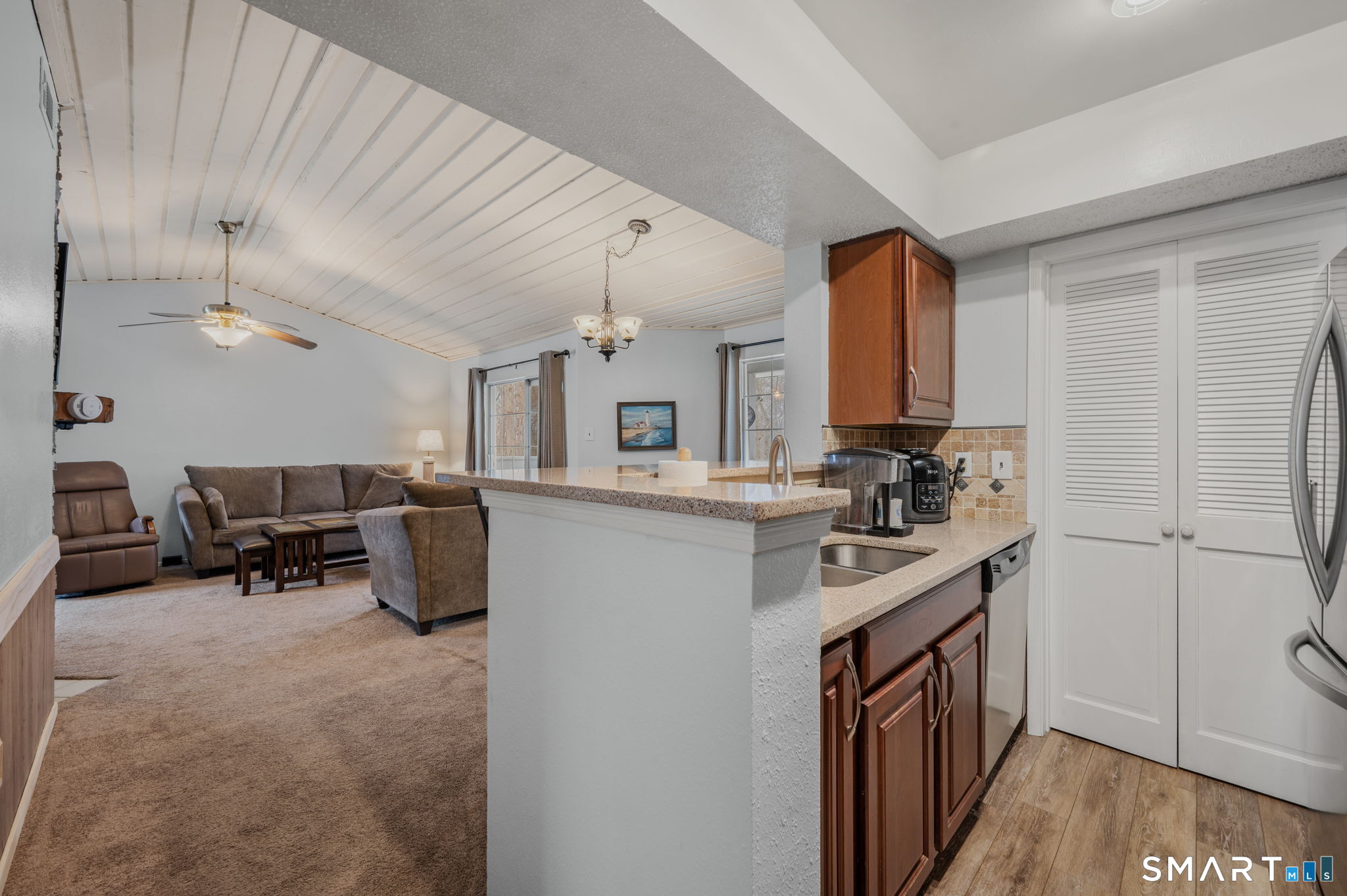 85 Crown Knoll Court, Unit 110 Groton, CT 06340 - Photo 14 of 23 a kitchen with sink cabinets and stove top oven