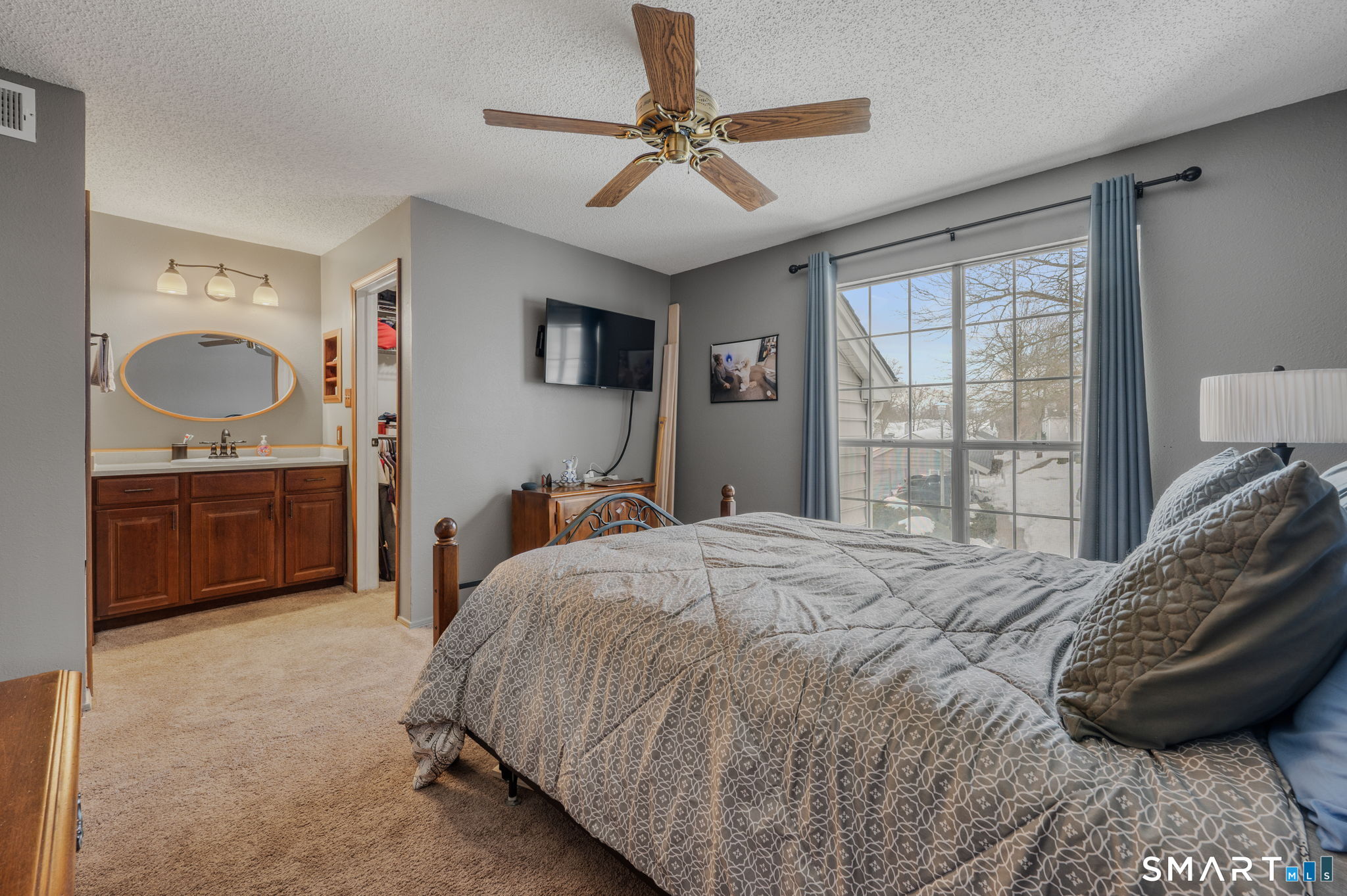 85 Crown Knoll Court, Unit 110 Groton, CT 06340 - Photo 19 of 23 a bedroom with a bed dresser and a window