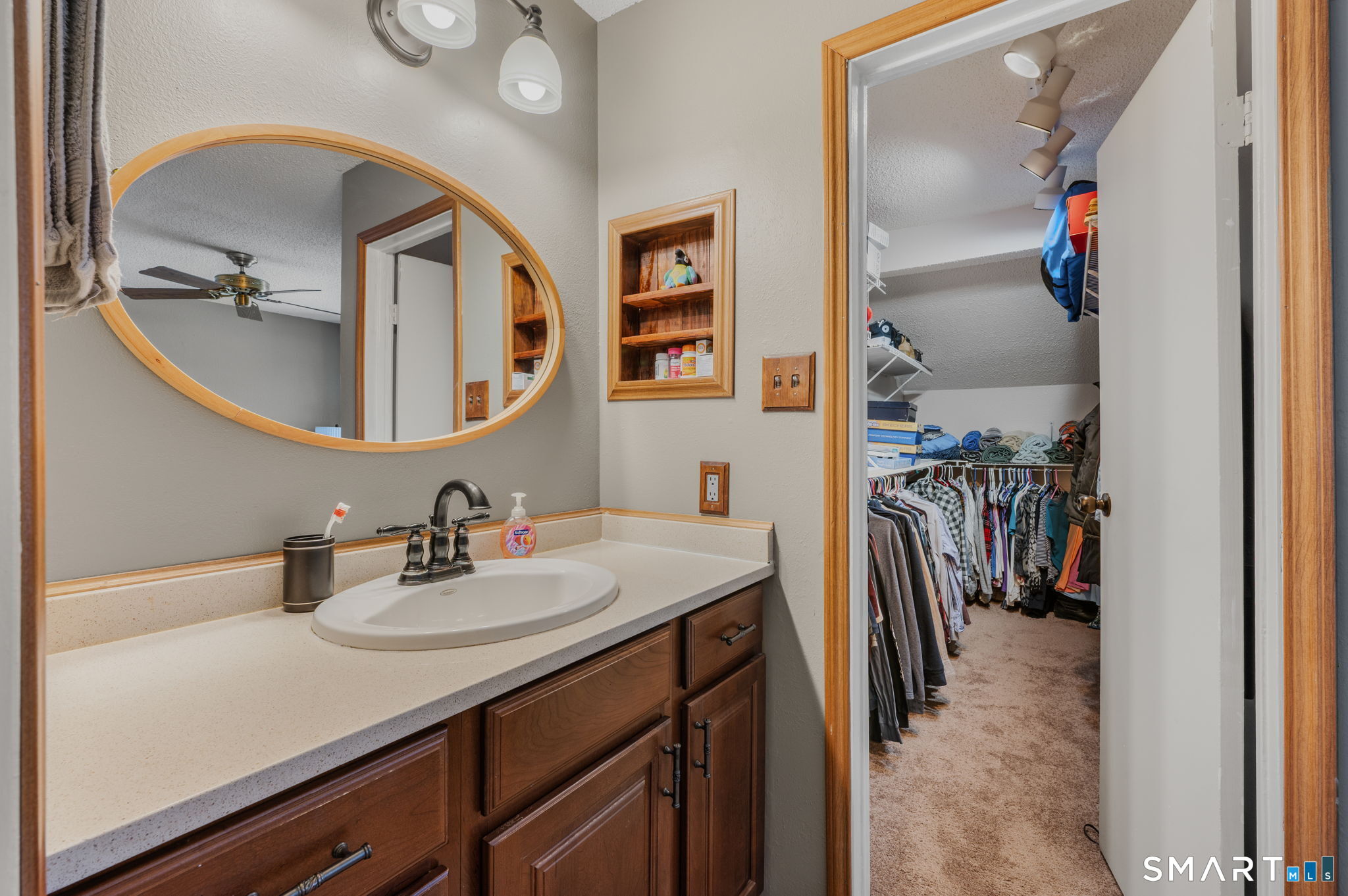 85 Crown Knoll Court, Unit 110 Groton, CT 06340 - Photo 20 of 23 a bathroom with a sink and a mirror