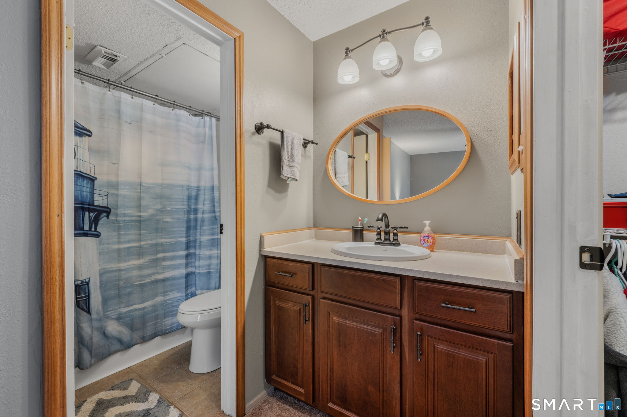 85 Crown Knoll Court, Unit 110 Groton, CT 06340 - Photo 22 of 23 a bathroom with a sink a toilet and shower