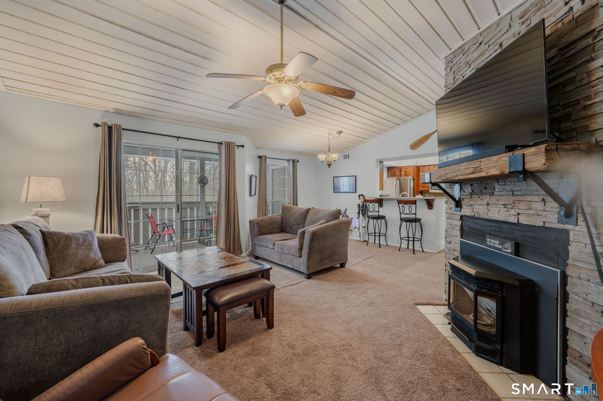 85 Crown Knoll Court, Unit 110 Groton, CT 06340 - Photo 3 of 23 a living room with furniture a ceiling fan and a fireplace