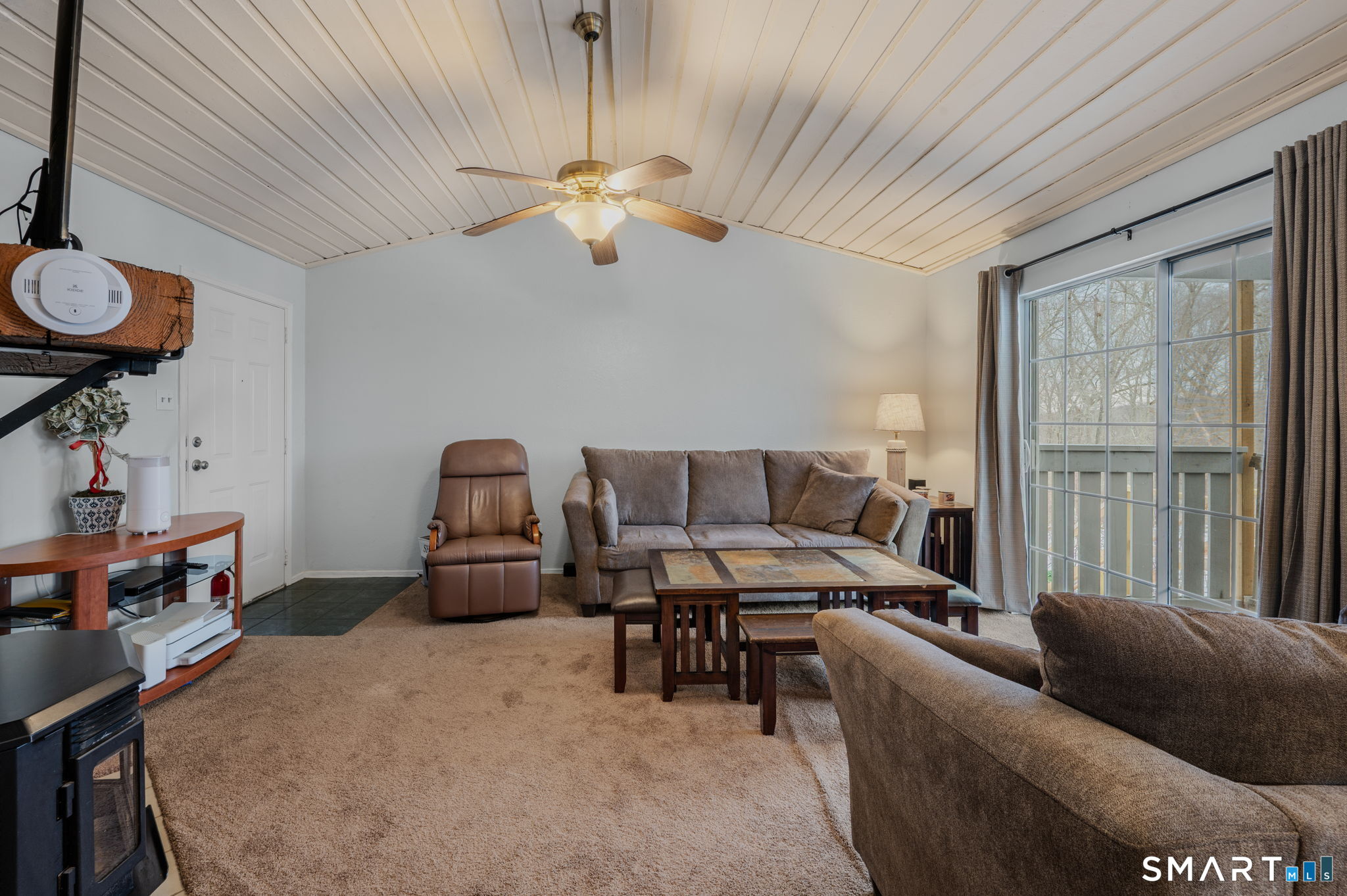 85 Crown Knoll Court, Unit 110 Groton, CT 06340 - Photo 5 of 23 a living room with furniture and a chandelier