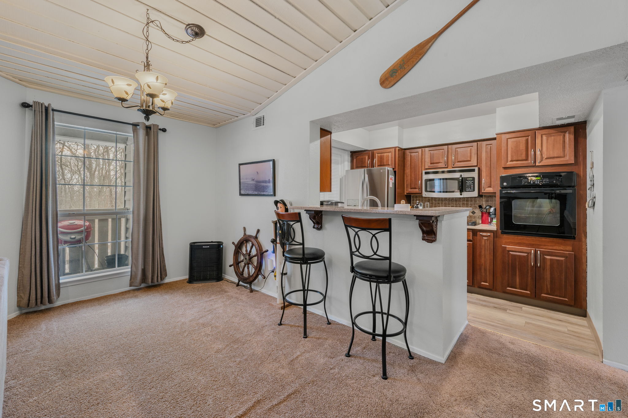 85 Crown Knoll Court, Unit 110 Groton, CT 06340 - Photo 10 of 23 a view of a dining room with furniture window and kitchen view