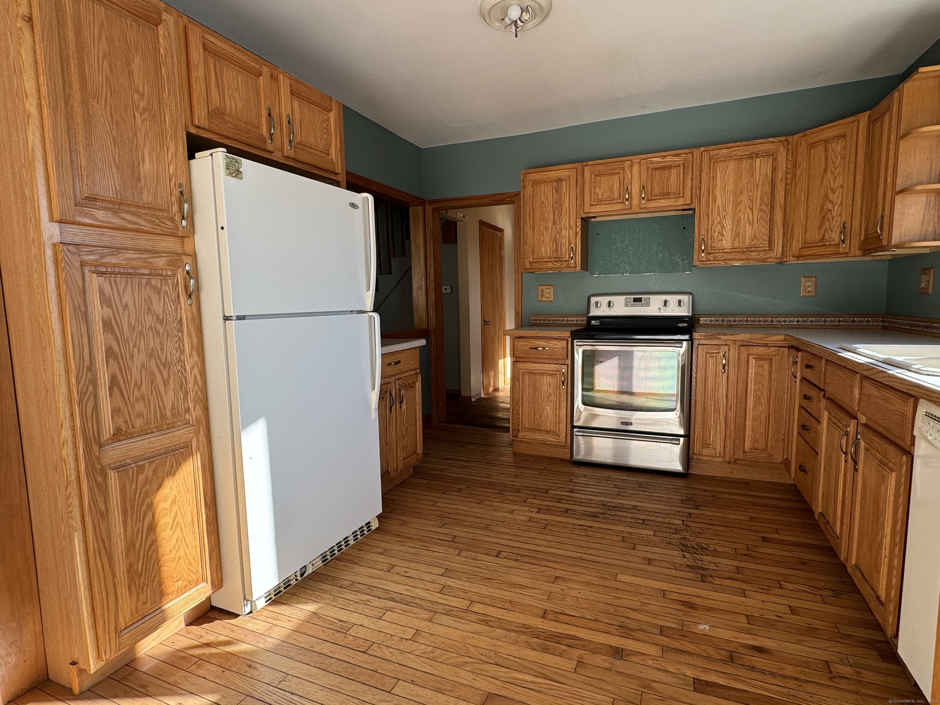 104 Cemetery Road Vernon, CT 06066 - Photo 4 of 28 a kitchen with stainless steel appliances a refrigerator and a stove top oven