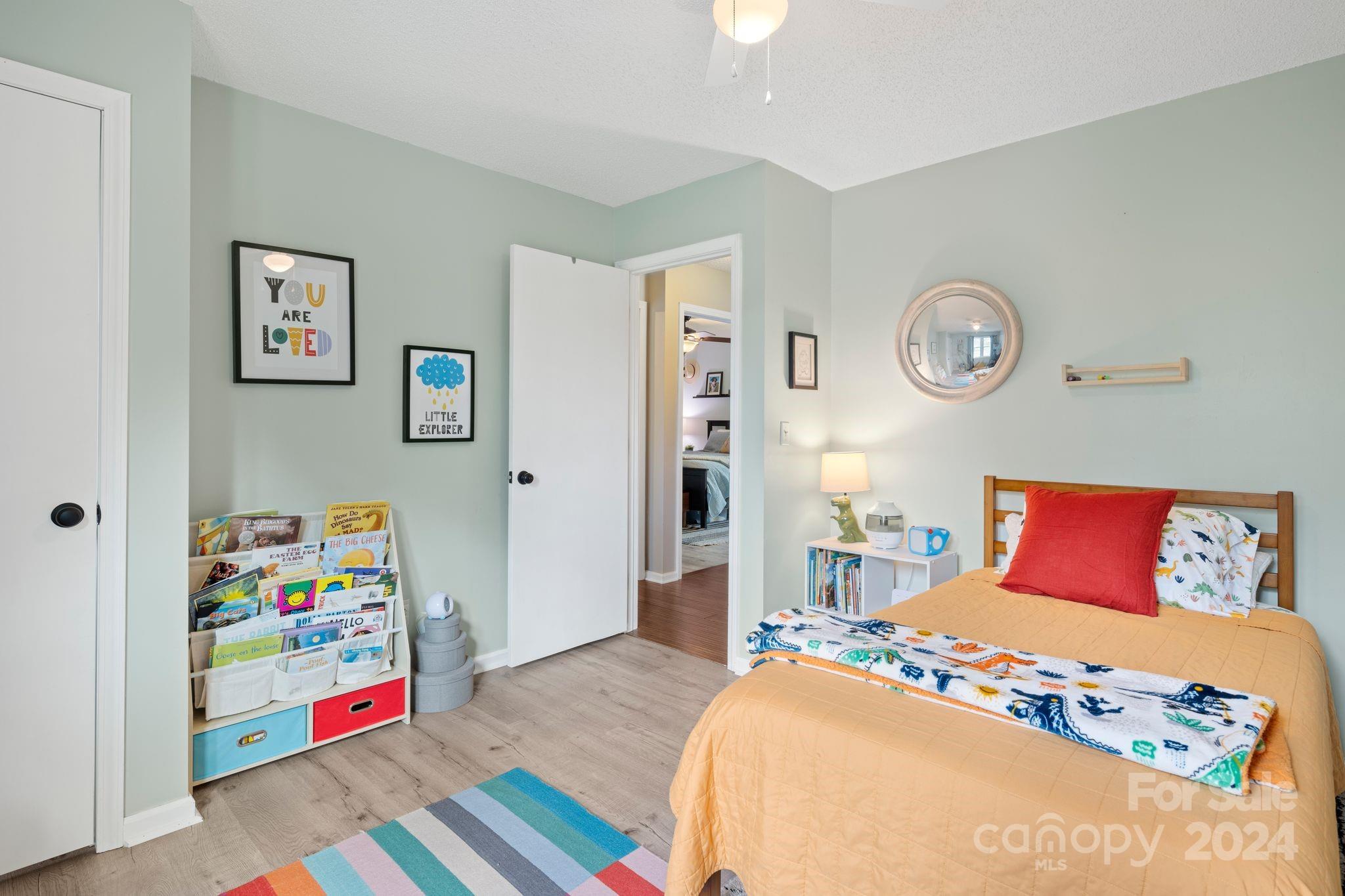 9 Mountain View Drive Arden, NC 28704 - Photo 11 of 19 a bedroom with a bed and wooden floor