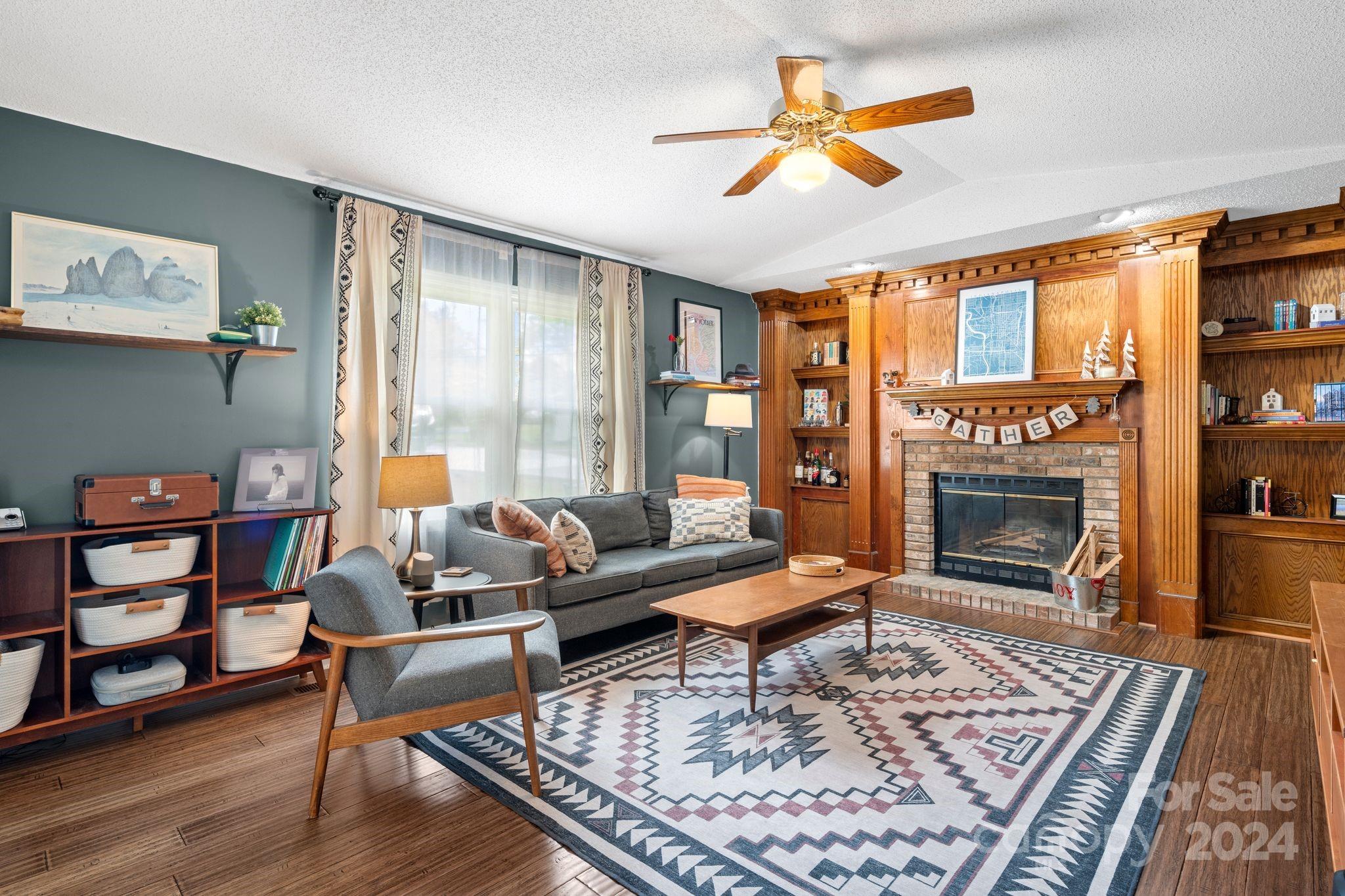 9 Mountain View Drive Arden, NC 28704 - Photo 8 of 19 a living room with furniture a rug and a fireplace
