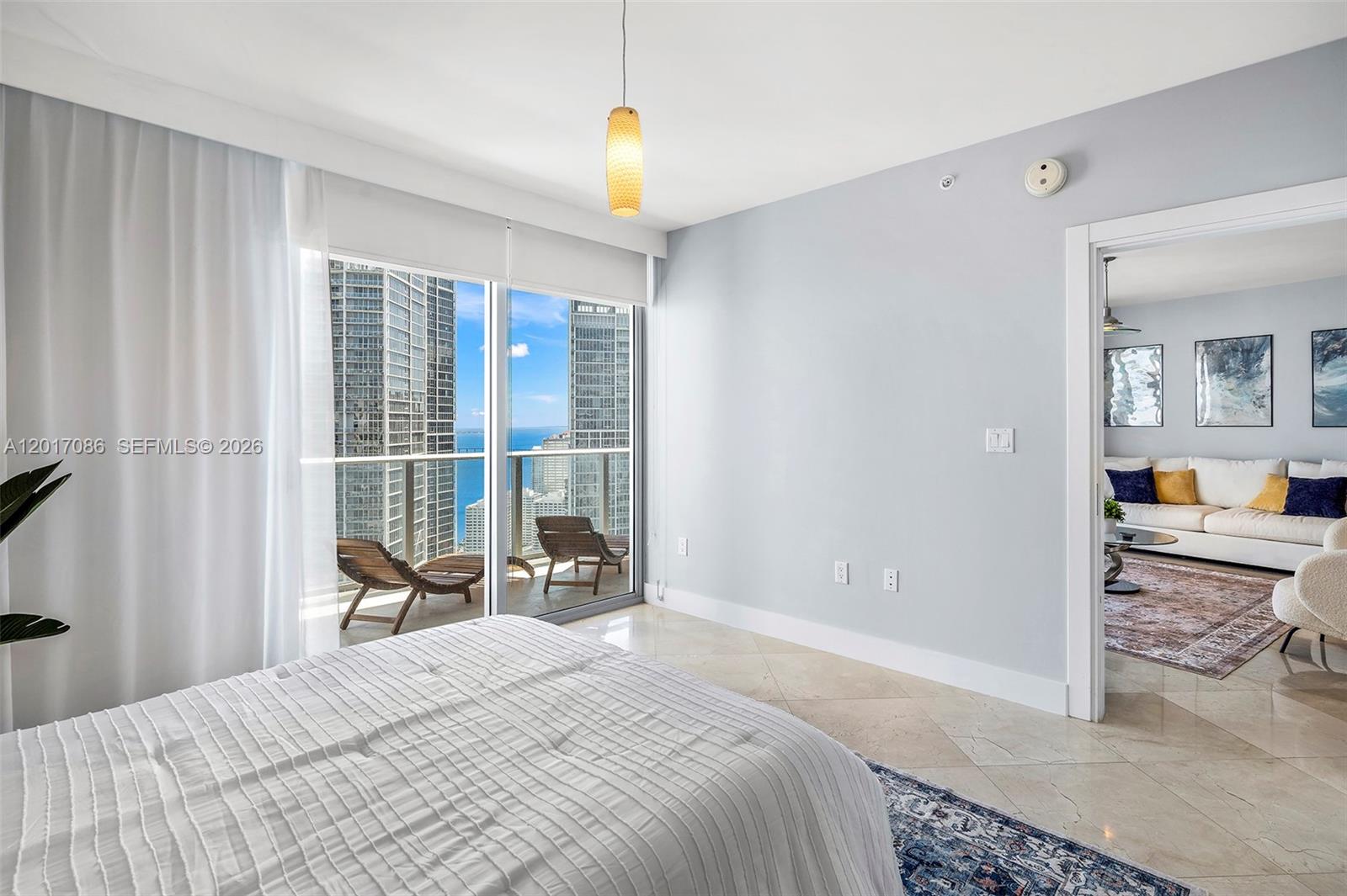 200 Biscayne Blvd Way, Unit 4308 Miami, FL 33131 - Photo 13 of 31 a bedroom with a bed and a large window