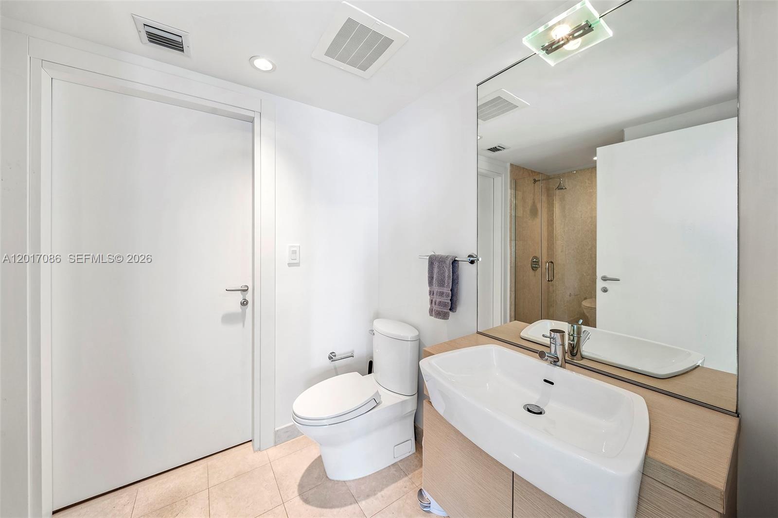 200 Biscayne Blvd Way, Unit 4308 Miami, FL 33131 - Photo 14 of 31 a bathroom with a sink toilet and shower