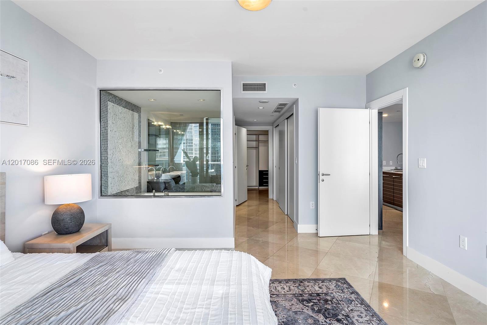 200 Biscayne Blvd Way, Unit 4308 Miami, FL 33131 - Photo 18 of 31 a bedroom with a bed and a couch