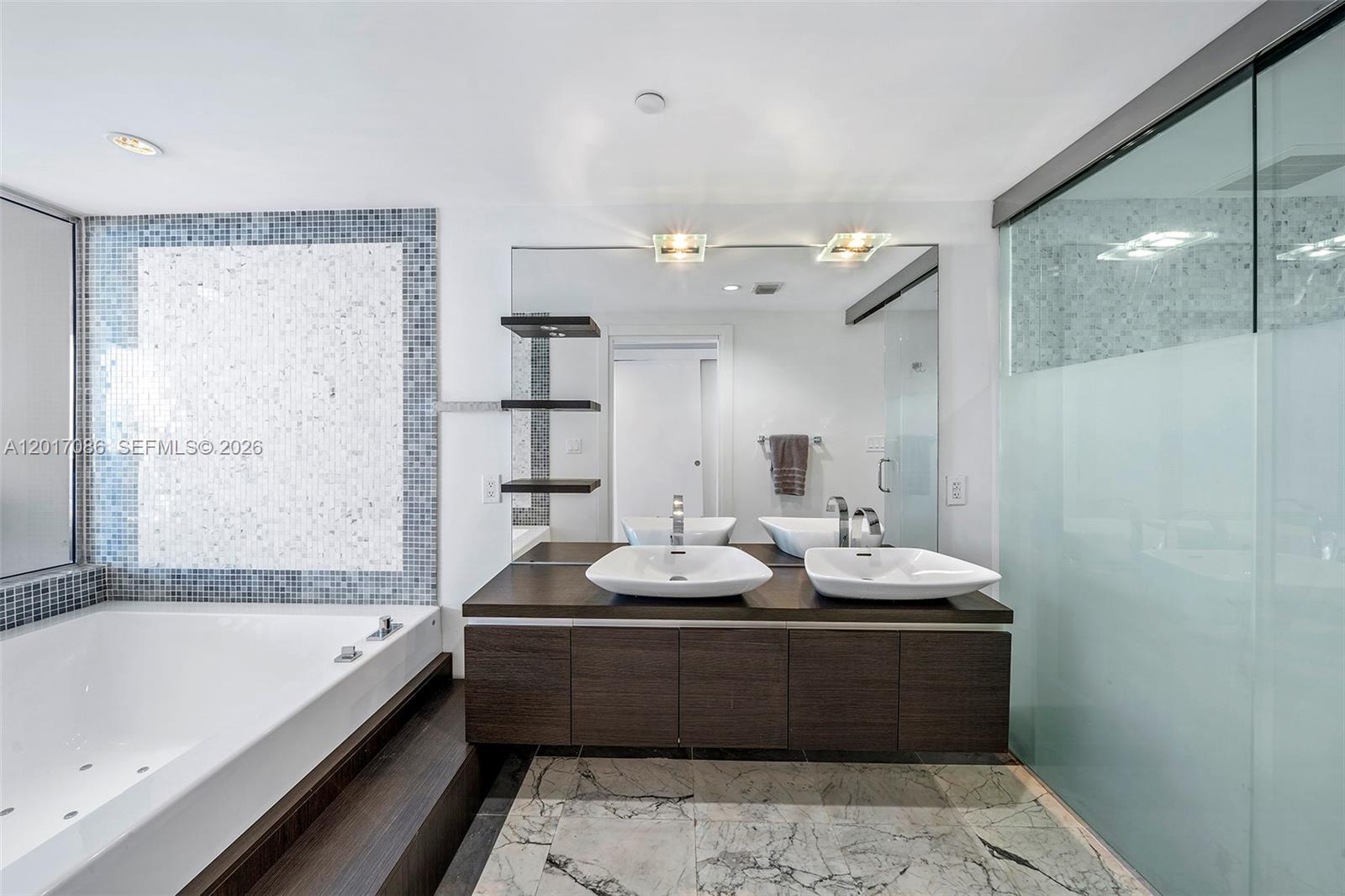200 Biscayne Blvd Way, Unit 4308 Miami, FL 33131 - Photo 19 of 31 a bathroom with a bathtub and a sink