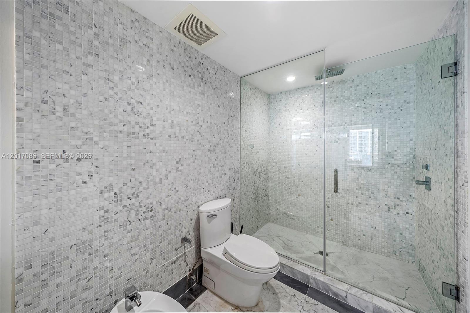 200 Biscayne Blvd Way, Unit 4308 Miami, FL 33131 - Photo 20 of 31 a bathroom with a toilet and a shower