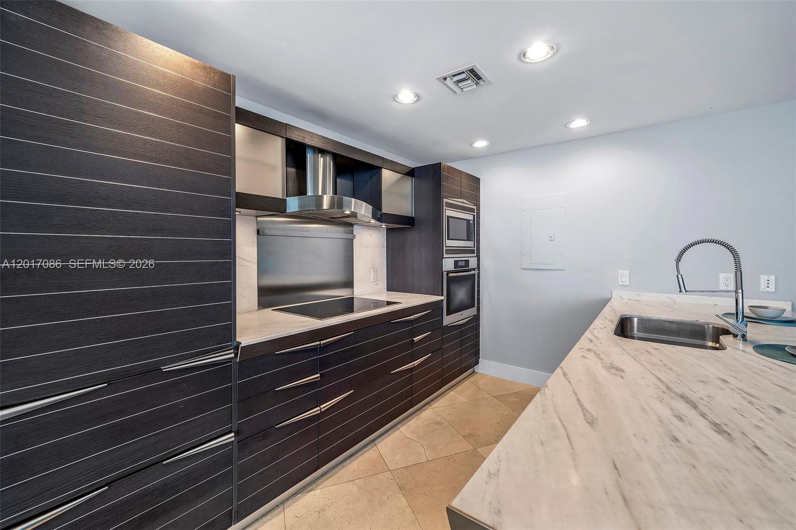 200 Biscayne Blvd Way, Unit 4308 Miami, FL 33131 - Photo 10 of 31 a bedroom with a bed and a sink