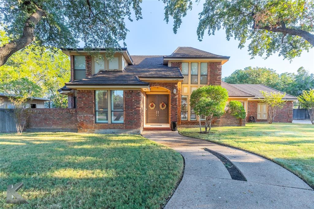 front view of a house with a yard